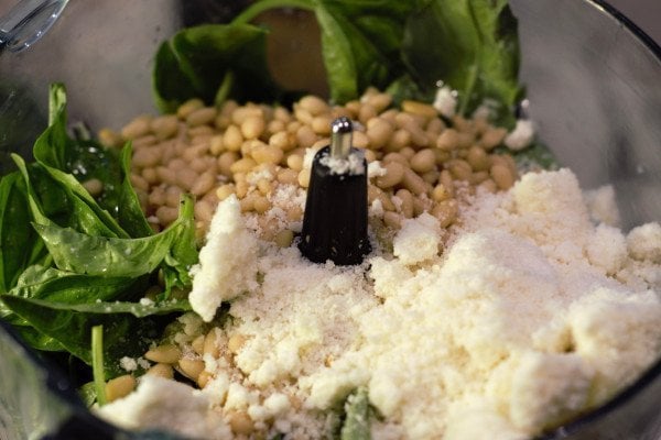 pesto ingredients in the food processor ready to be chopped.