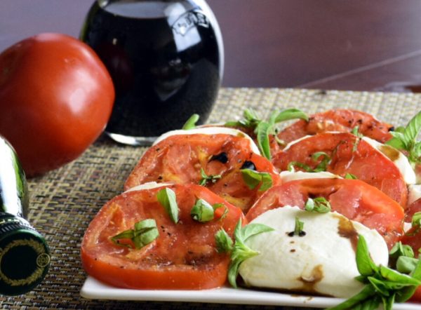 Grilled Tomato Caprese Salad lightly drizzled with olive oil and balsamic vinegar.