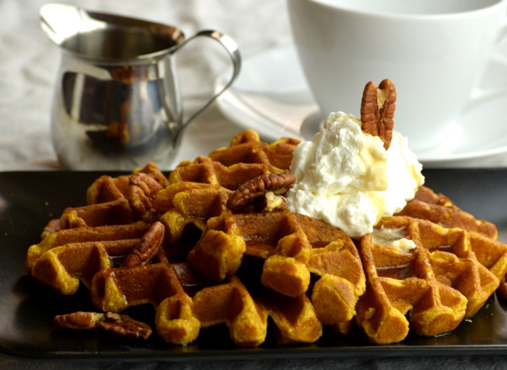 Pumpkin Waffles with warm Maple syrup and pecans