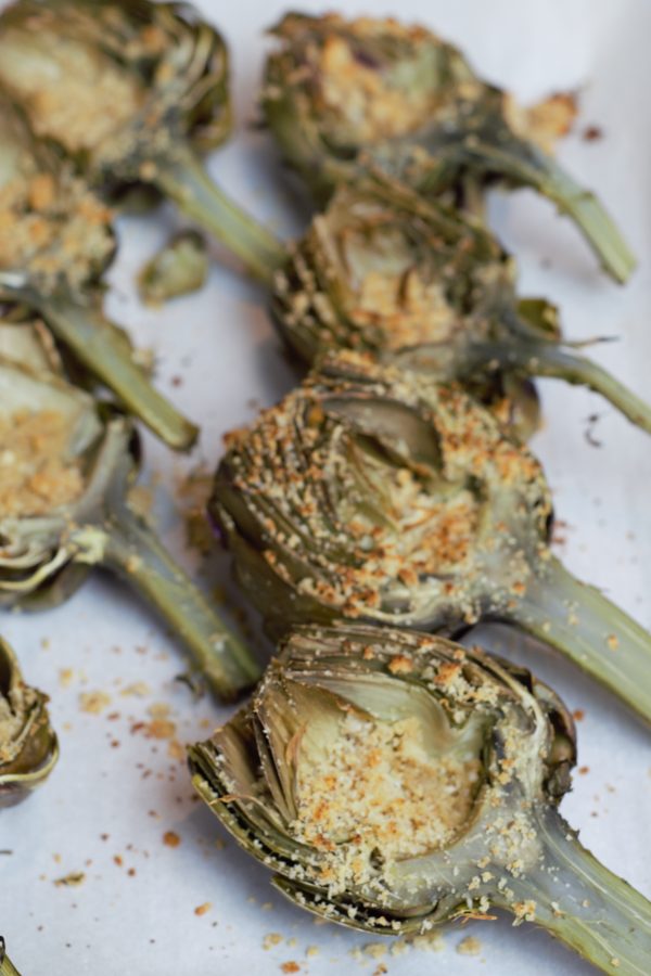 Spread the filling in between the layers of leaves and fill the cleaned center before putting under the broiler.