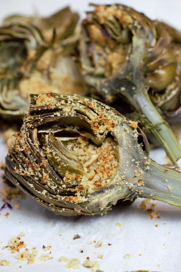 Perfectly cooked Parmesan Stuffed Artichokes ready to devour.