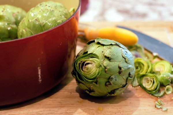 Large Artichoke with the top trimmed, ready to go into the steam pot.