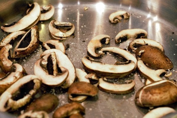 sliced mushrooms in a pan