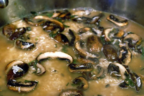 Rice simmering in wine and water.
