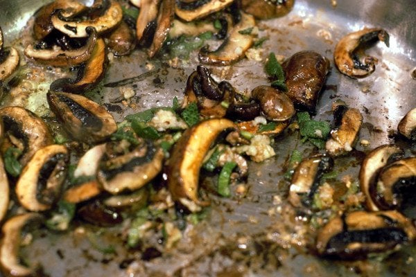 finished criminis with garlic, butter, sage in a pan