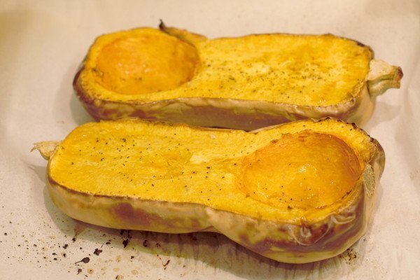 Roasted Butternut Squash halves with nutmeg, salt, pepper, and chili powder.
