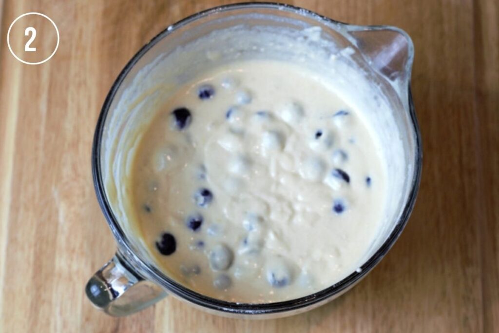 pancake batter with blueberries mixed in
