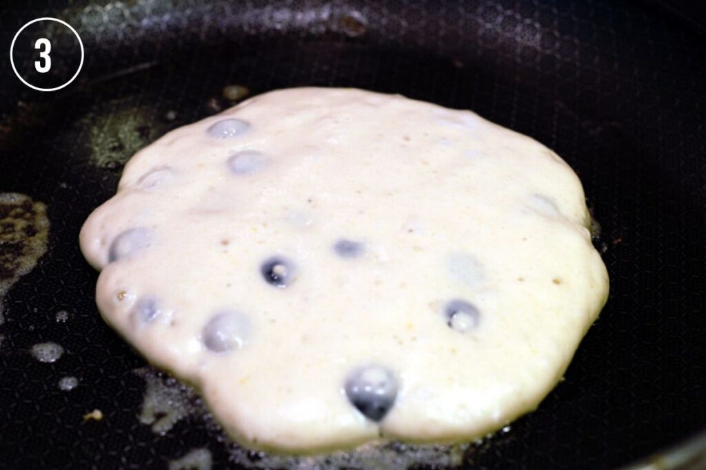 pancake batter in hot pan