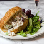 close up waldorf croissant sandwich for featured image