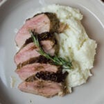 roasted pork tenderloin sliced on plate