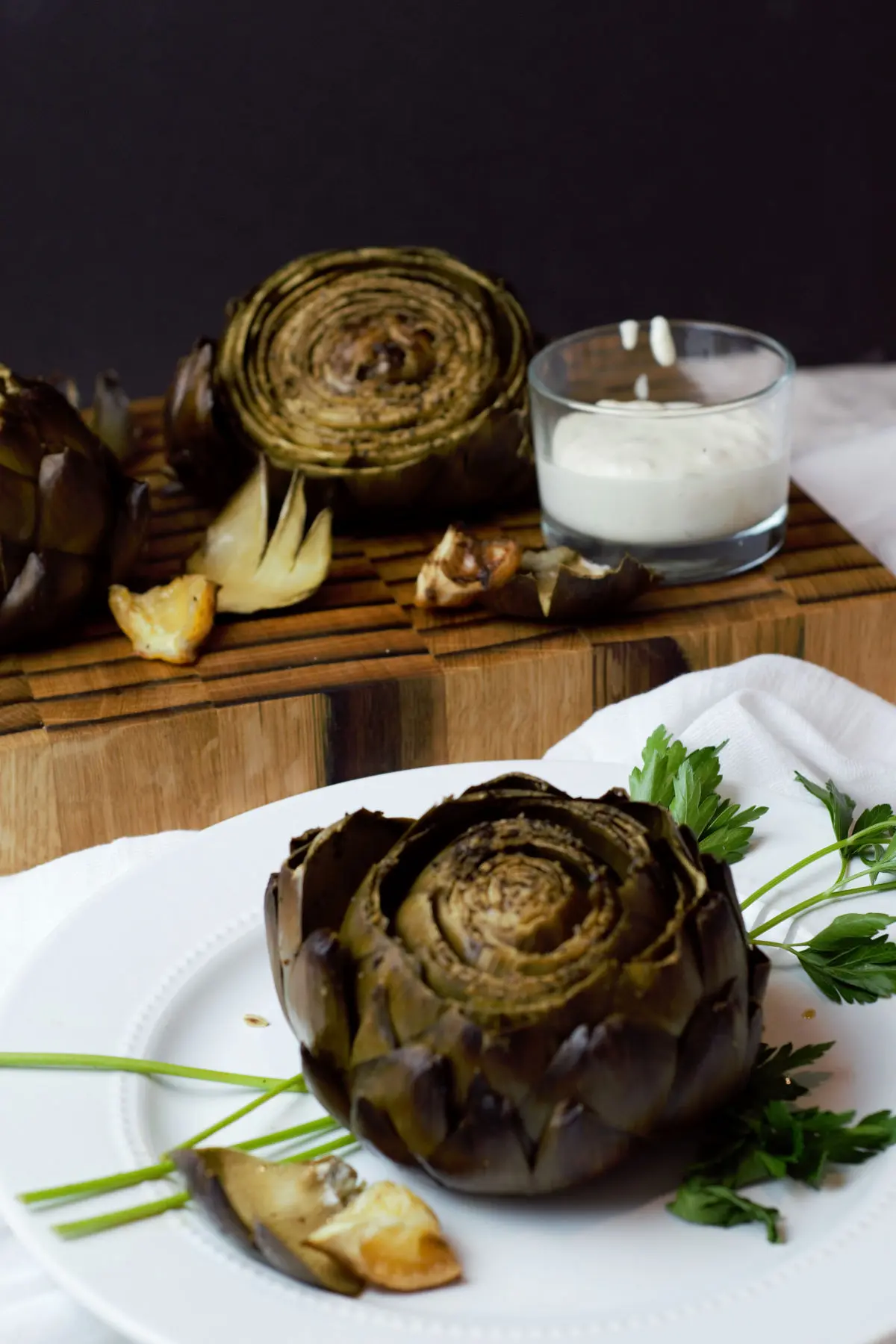 Finished artichokes with dipping sauce