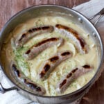 Bratwurst in pan with gravy
