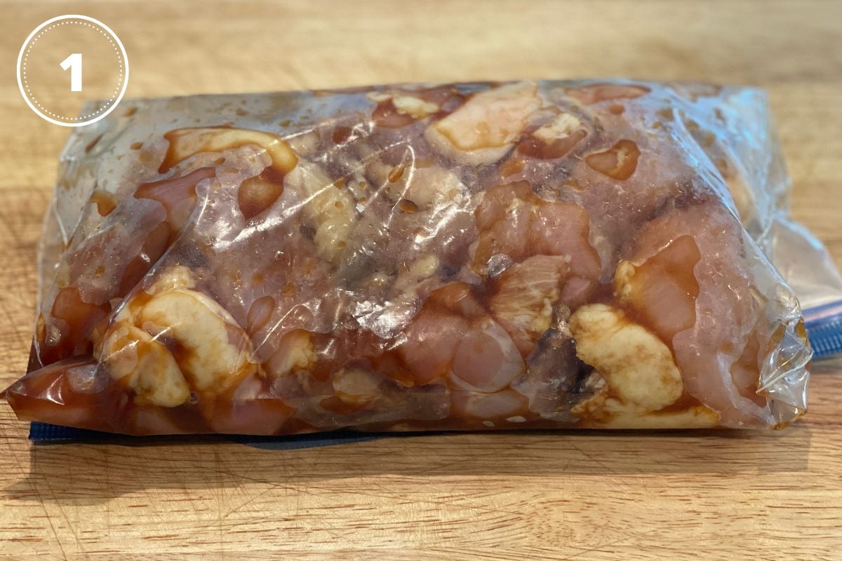 raw chicken in food storage bag with marinade