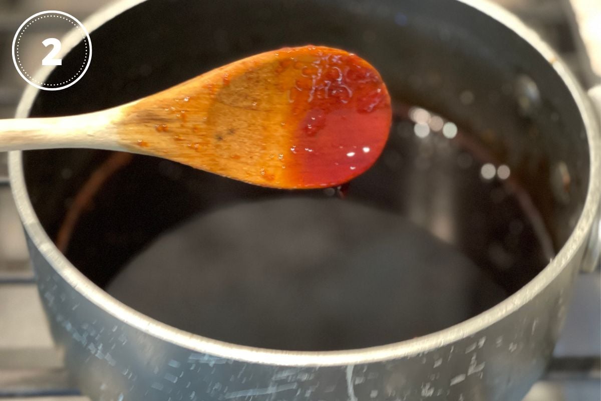 wooden spoon with teriyaki sauce to show thickness