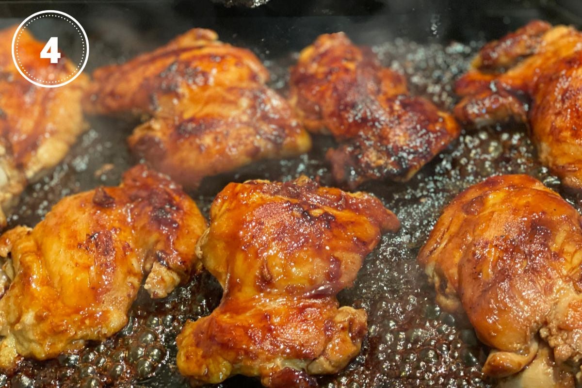 chicken thighs in pan with teriyaki glaze