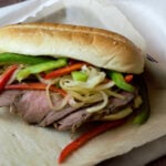 feature image close up tri-tip sandwich on parchment paper
