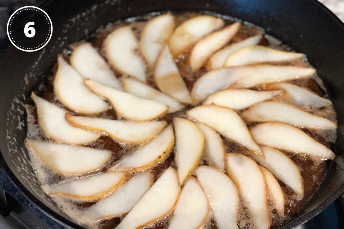 pears in caramel sauce in a cast-iron skill