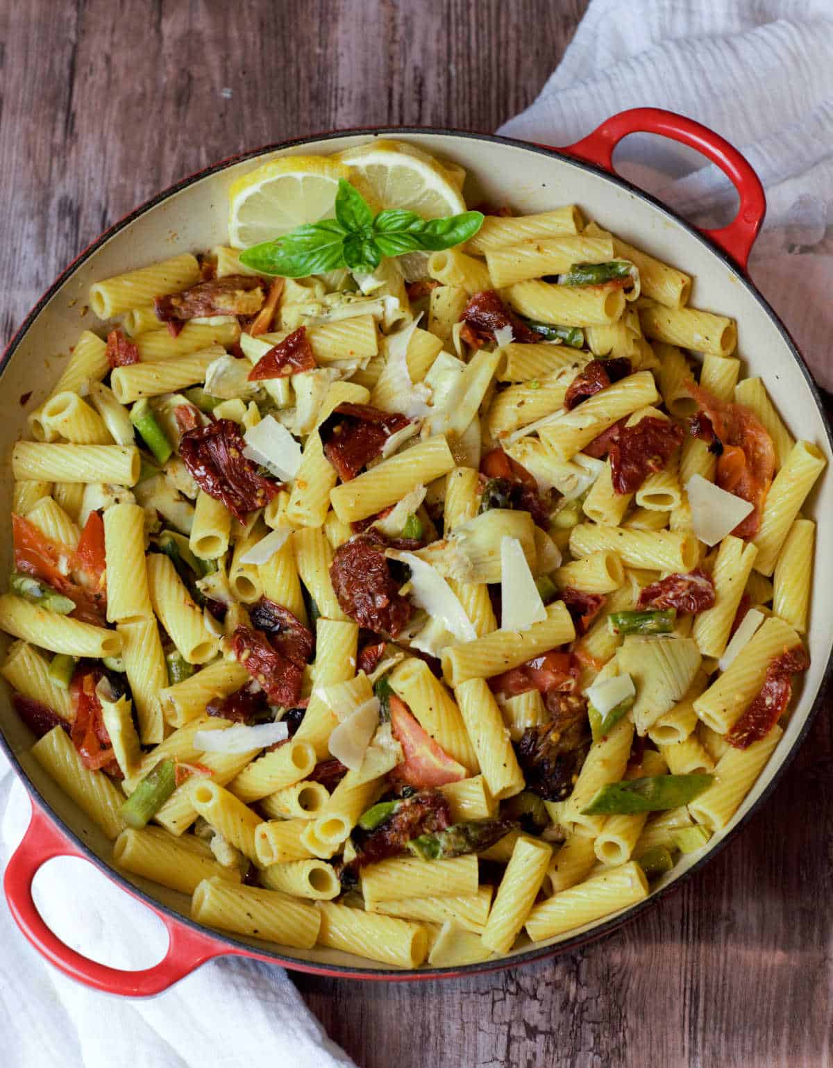 hero shot pasta with roasted vegetables in red pot