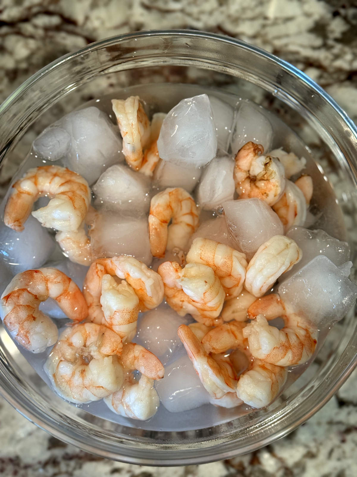 boiled shrimp in bowl of ice water