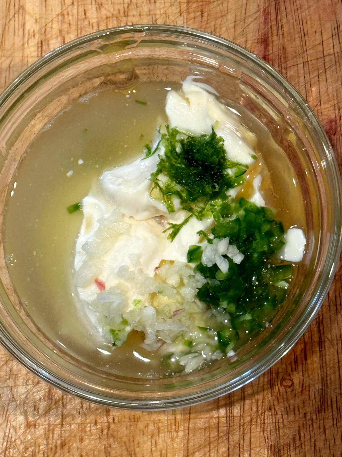 ingredients for jalapeno honey dressing unmixed in glass bowl