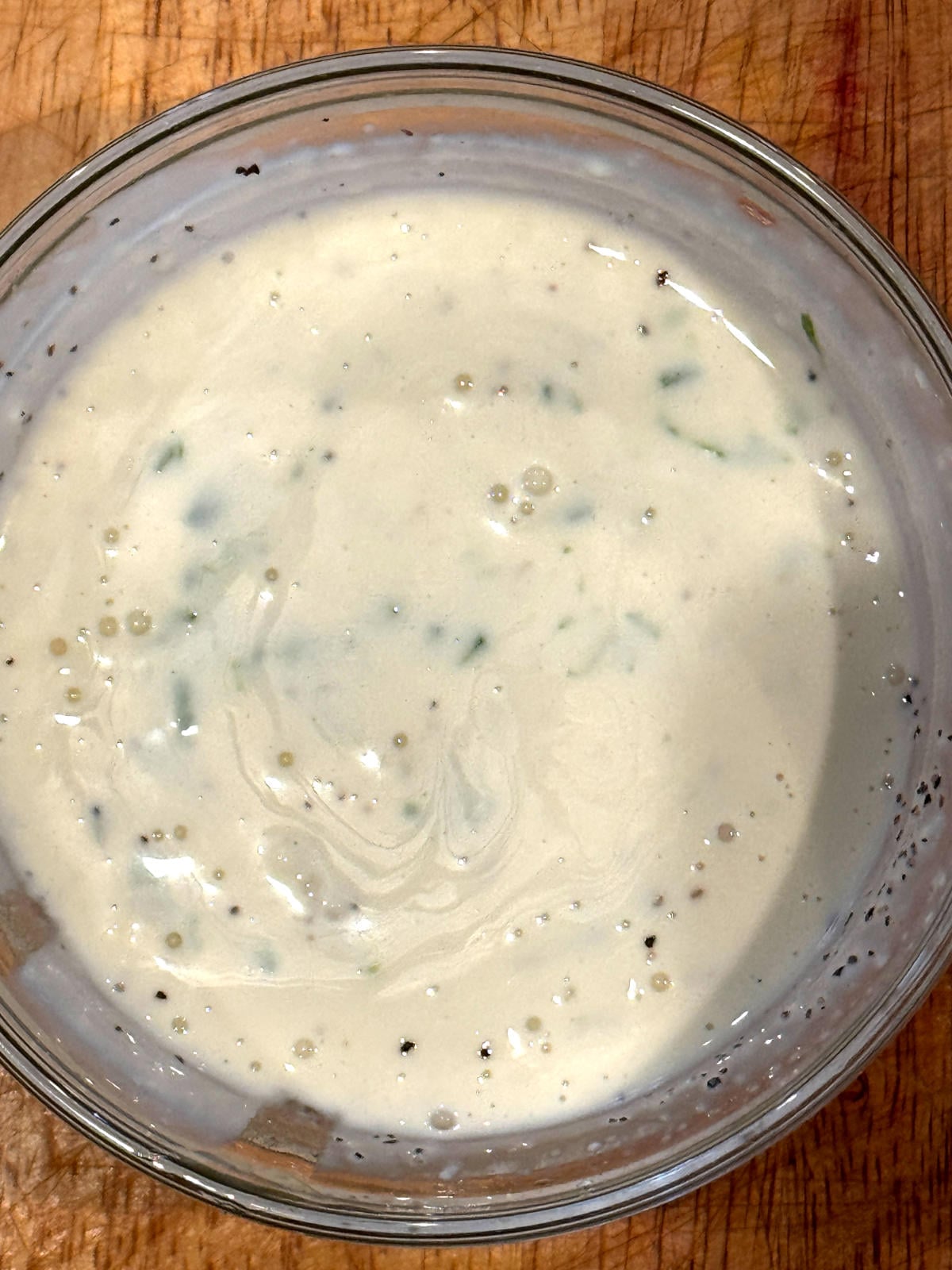jalapeno honey dressing mixed together in a small glass bowl
