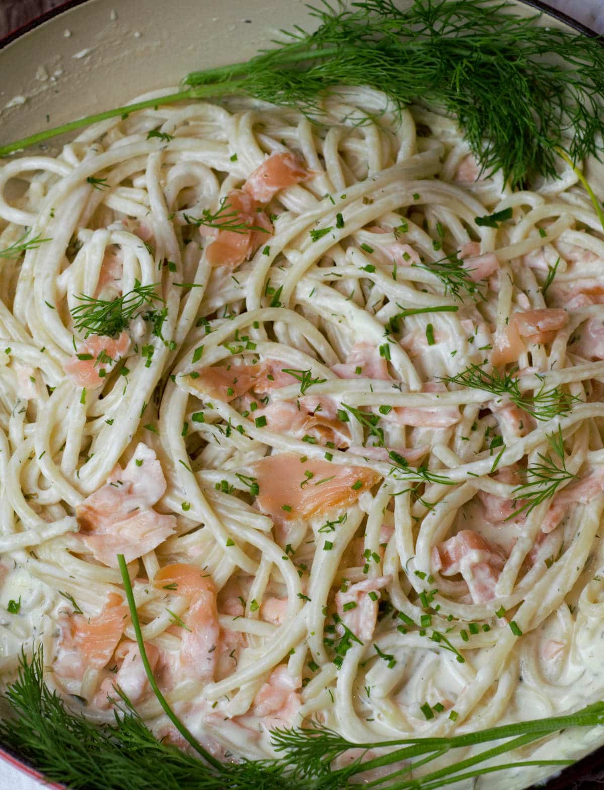 overhead shot of smoked salmon pasta in cream sauce