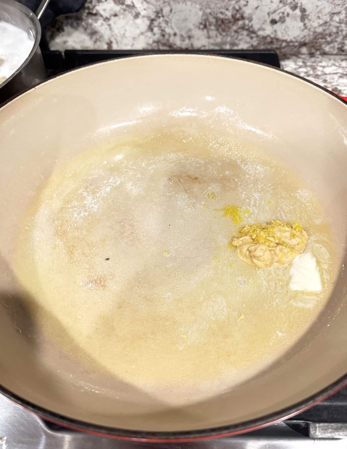 melted butter, lemon zest, and dijon mustard in pan