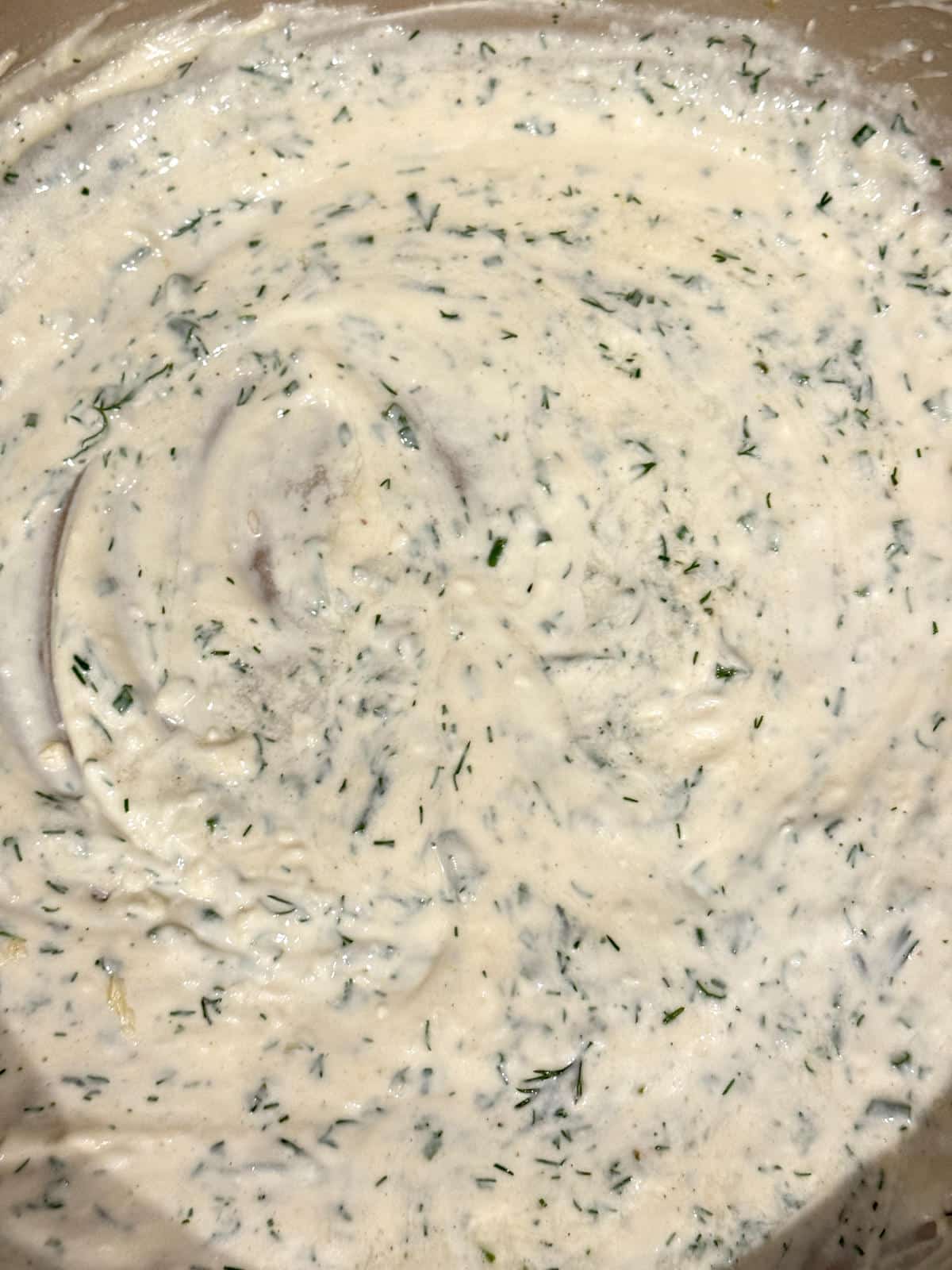 creamy herb sauce in pan