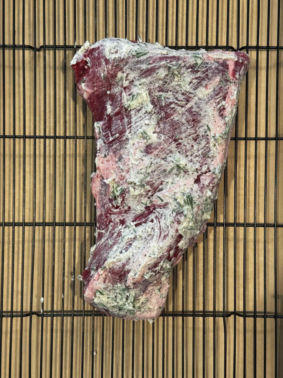 trimmed roast compound butter on baking rack