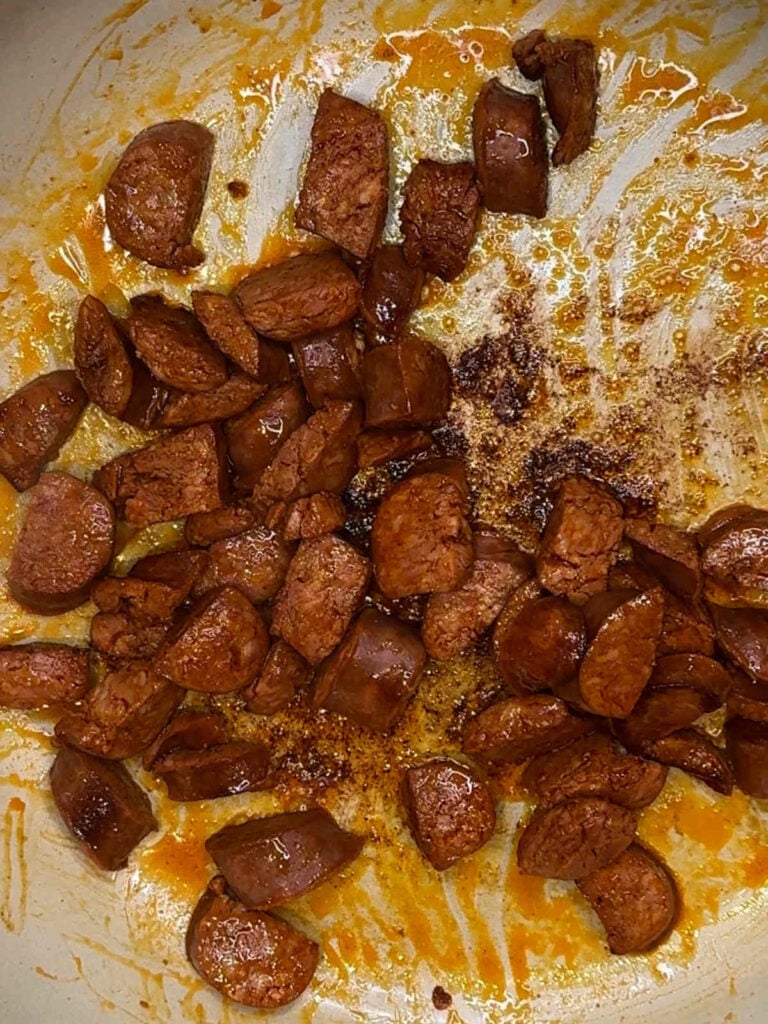 browning Spanish Chorizo in pot