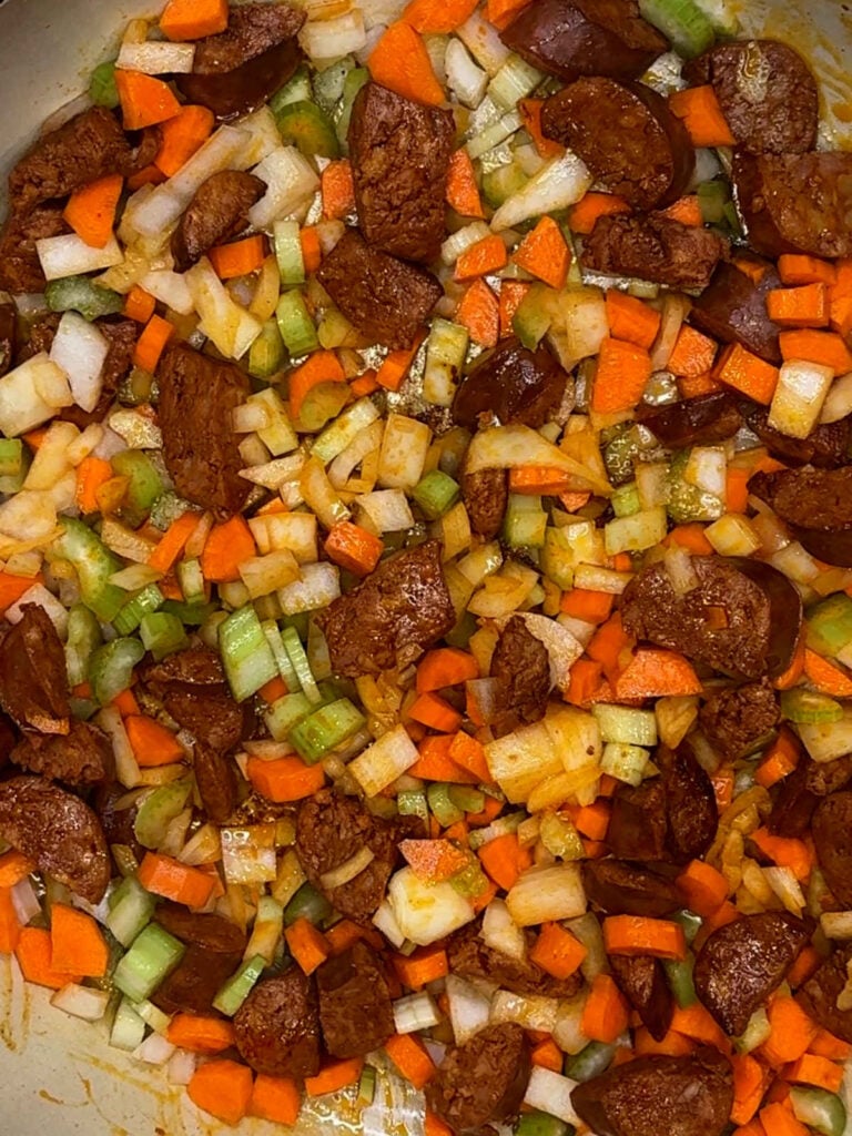 vegetables and chorizo in pot